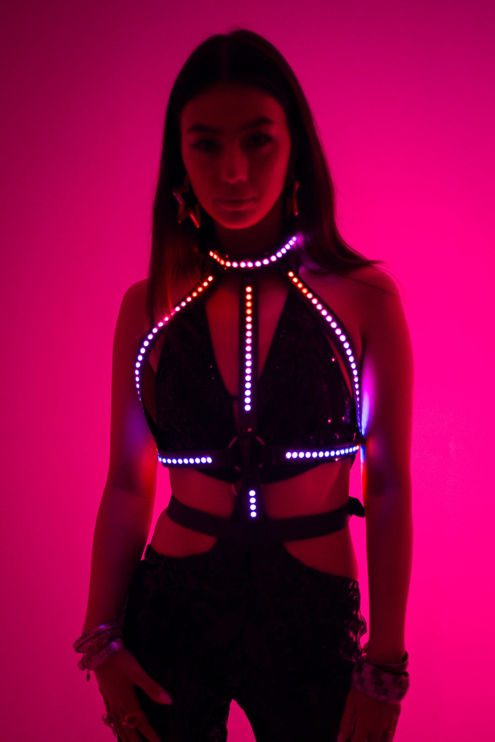 Glow Up Bikini Harness featuring Afterglow Cross LED Harness with red and purple lights. Ideal for rave and festival wear from Wild Thing.