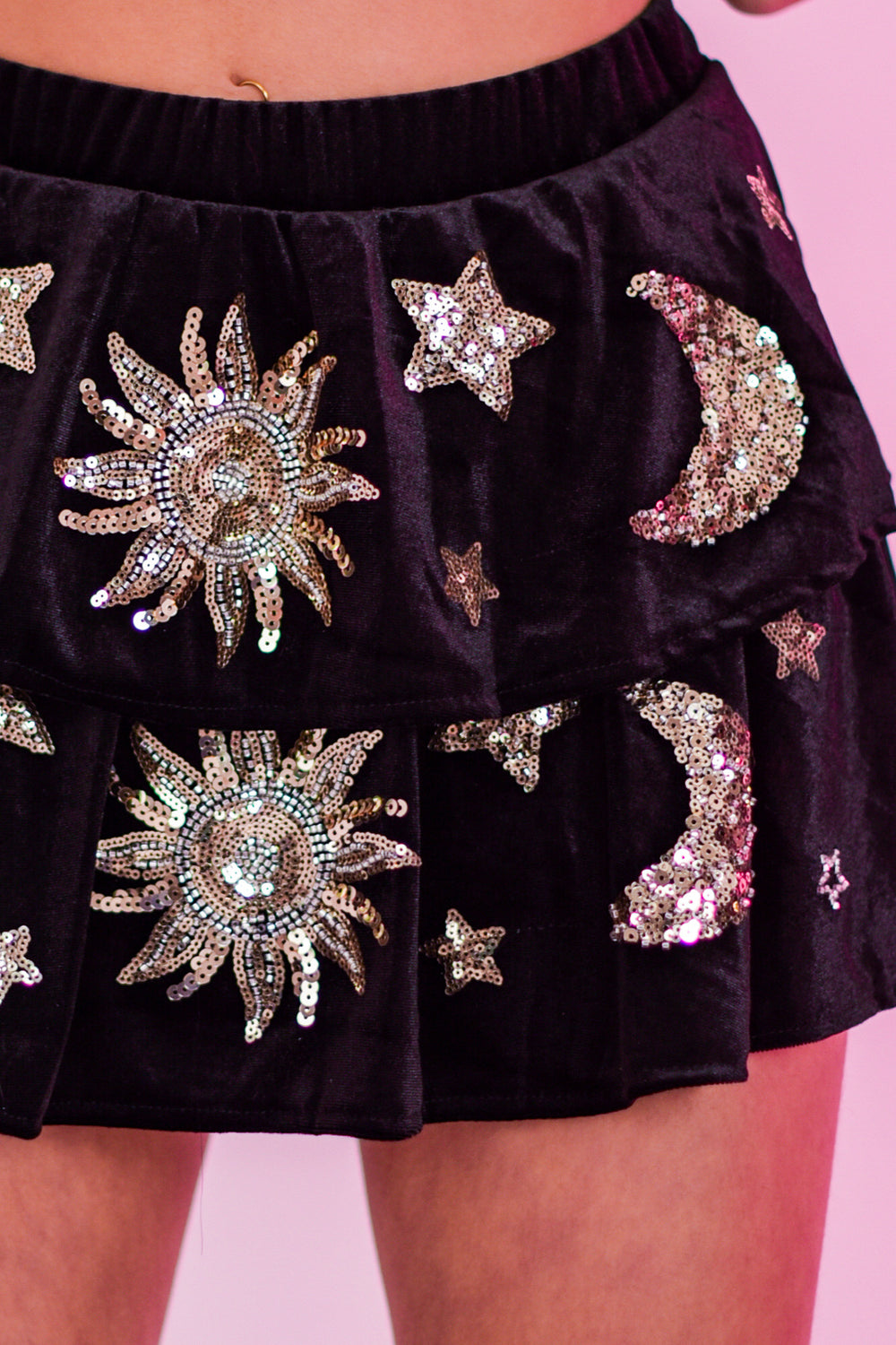 Close-up of The Phase Skirt showing detailed sequin celestial designs on layered black fabric, ideal for alternative festival fashion.